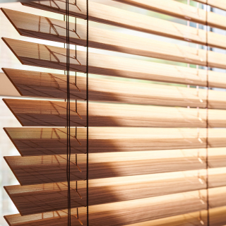 Light enters through 2" high gloss wood blinds.