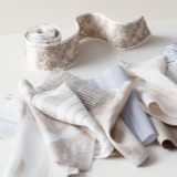 Fabric Swatches and Trim on scattered on a white table