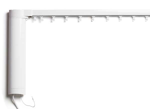 The Shade Store's drapery track in white laid on a white table top
