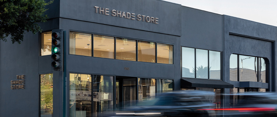 The Shade Store's Beverly Hills all black Showroom Exterior with large windows and cars quickly passing