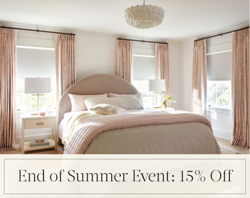 End of Summer Event: 15% Off written in black text over an image of Blackout Drapery & Roller Shades in a pink and white bedroom