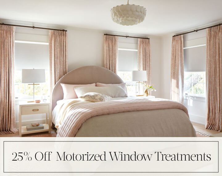 25% Off Motorized Window Treatments in black text over an image of Blackout Drapery & Roller Shades in a bedroom