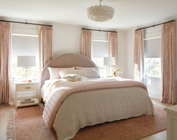 Blackout Tailored Pleat Drapery in Chinoiserie, Blush & Roller Shades in Ava, Birchwood darken a pink and white bedroom