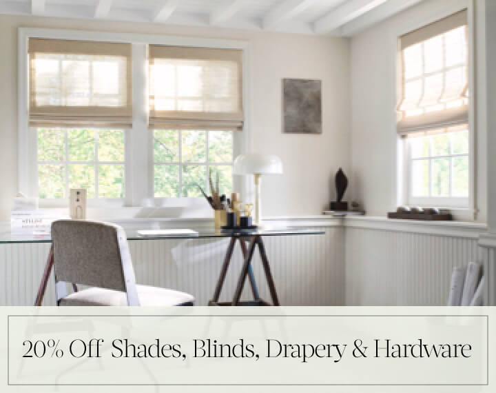 20% Off Shades, Blinds, Drapery & Hardware in black text over an image of Grassweave Cordless Woven Wood Shades in an office