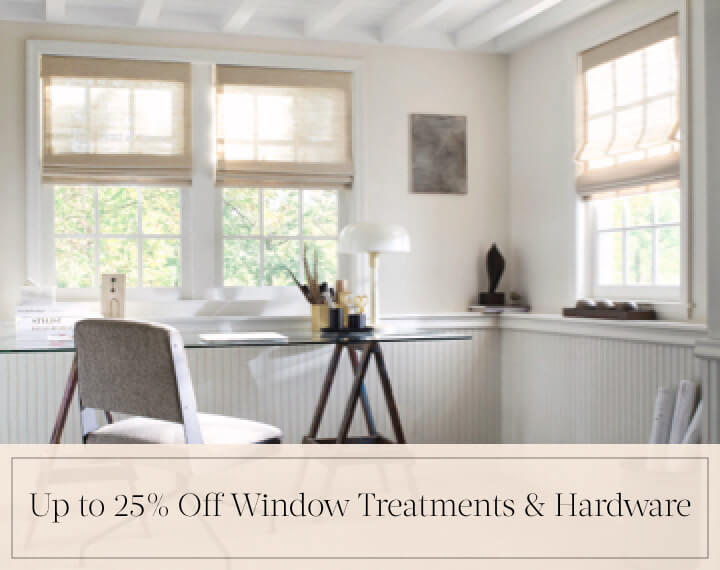 Up to 25% Off Window Treatments & Hardware in black text over an image of Grassweave Cordless Woven Wood Shades in an office