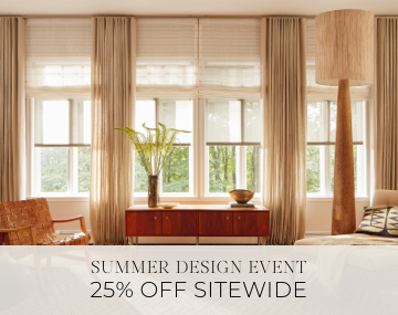Layered shades & drapery add dimension to a living room with wood decor & sales messaging for Summer Design Event 25% Off