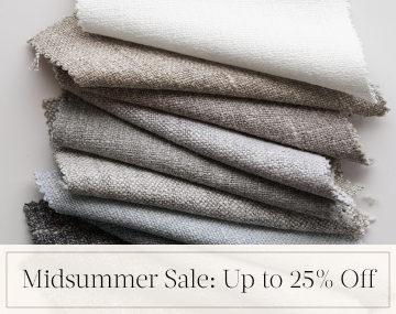 A swatch of Luxe Sheer Linen placed in a cream bowl on a white table top with overlaid text, Midsummer Sale: Up to 25% Off