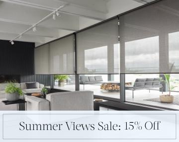 Solar Shades made of 5% Metallic in Zinc cover living room windows with sales messaging for Summer Views Sale: 15% Off