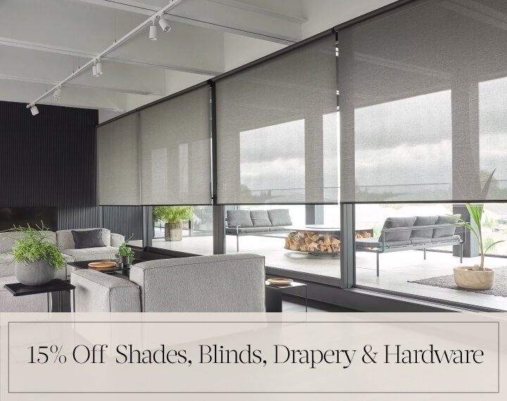 15% Off Shades, Blinds, Drapery & Hardware in black text over image of Flat Roman Wool Blend Fabric Shades on bedroom windows