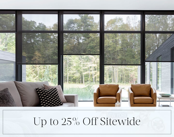 Up to 25% Off Sitewide in black text over an image of living room windows dressed black Solar Shades.