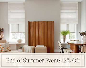 End of Summer Event: 15% Off written in black text over an image of Motorized Roman and Roller Shades in a family room