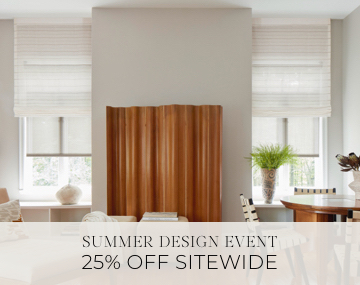 Motorized Roman and Roller Shades hang in a family room with wood decor with sales messaging for Summer Design Event 25% Off