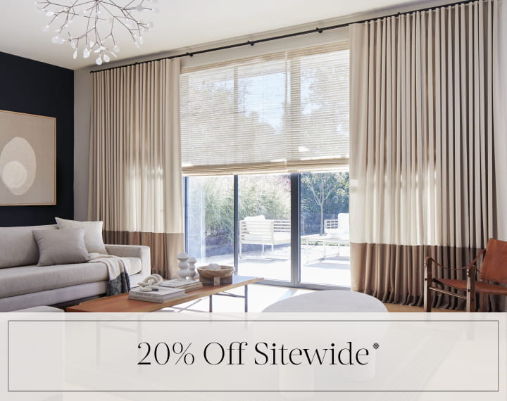 20% Off Sitewide in black text over an image of windows with Woven Wood Shades and Drapery.