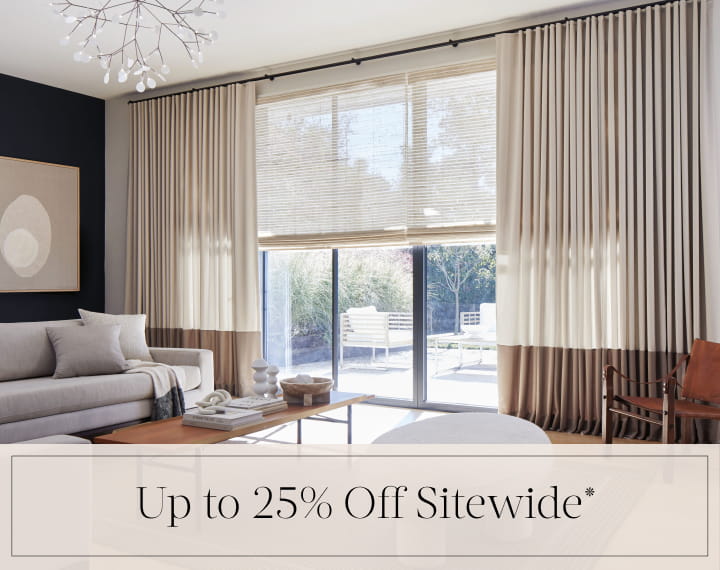 Up to 25% Off Sitewide in black text over an image of windows with Woven Wood Shades and Drapery.
