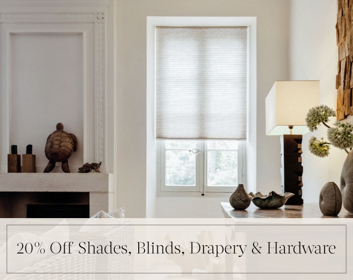 20% Off Shades, Blinds, Drapery & Hardware in black text over an image of a window with light filtering Cellular Shades.
