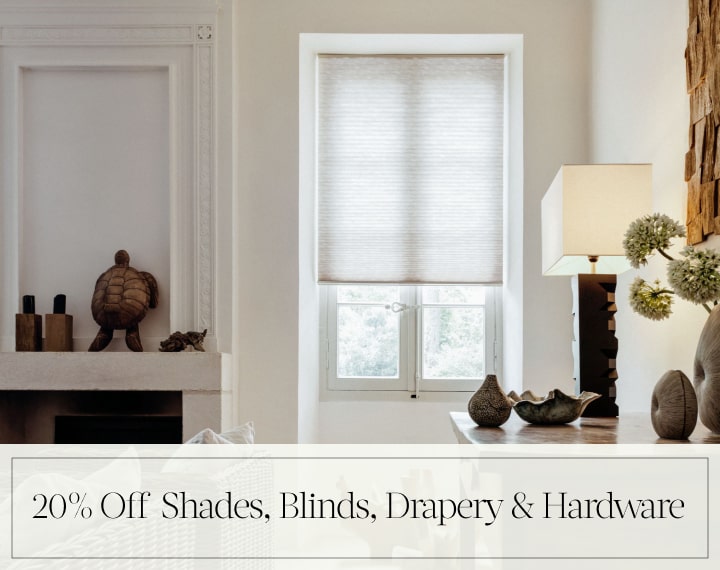 20% Off Shades, Blinds, Drapery & Hardware in black text over an image of a window with light filtering Cellular Shades.
