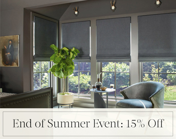 End of Summer Event: 15% Off written in black text over an image of Flat Roman Shades in Wool Blend fabric on bedroom windows