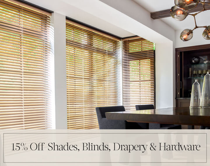 15% Off Shades, Blinds, Drapery & Hardware in black text over an image of 2-in Champagne Metal Blinds on dining room windows