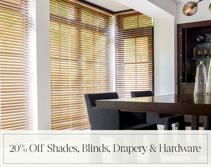20% Off Shades, Blinds, Drapery & Hardware in black text over an image of dining room windows with Champagne Metal Blinds.