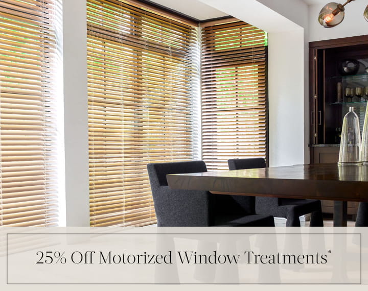 25% Off Motorized Window Treatments in black text over an image of dining room windows with Champagne Metal Blinds.