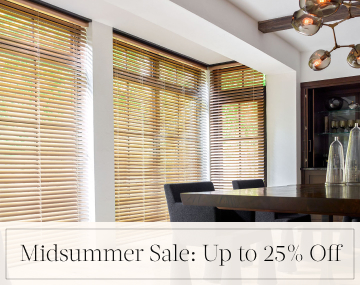 2 Inch Champagne Metal Blinds cover tall windows in a modern dining room with overlaid text, Midsummer Sale: Up to 25% off