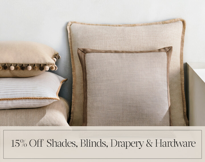 15% Off Shades, Blinds, Drapery & Hardware in black text over an image of Square Pillows in neutral fabrics with various trim