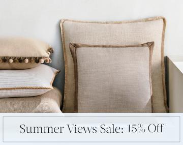 Square Pillows feature neutral colored fabric and various piping styles with sales messaging for Summer Views Sale: 15% Off