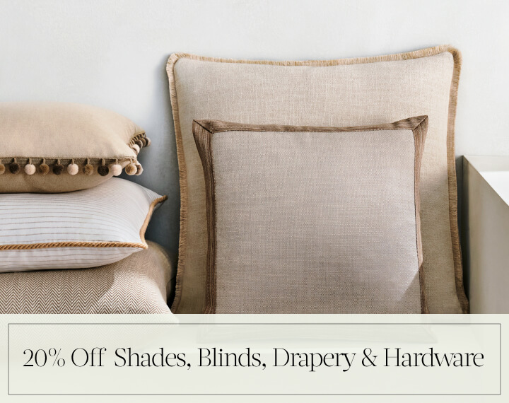 20% Off Shades, Blinds, Drapery & Hardware in black text over an image of Square Pillows in neutral fabrics with various trim