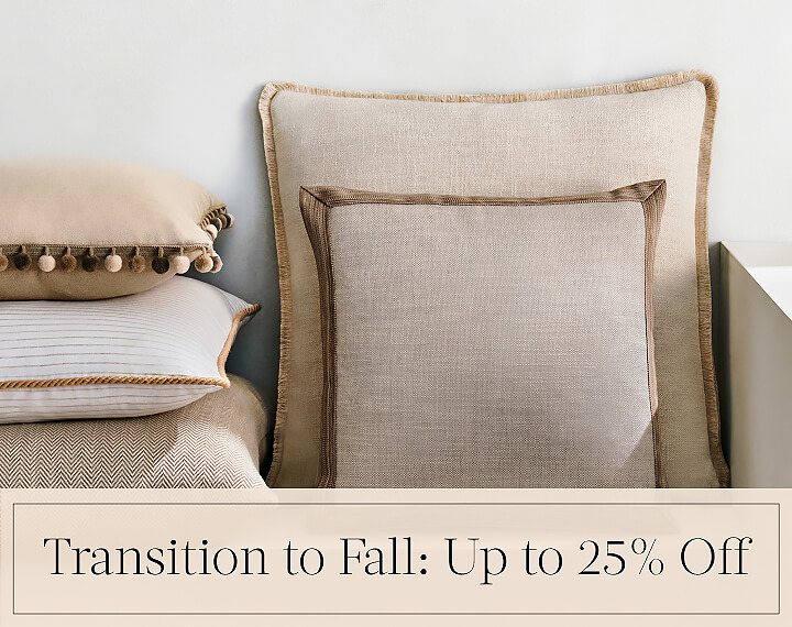 Transition to Fall: Up to 25% Off written in black text over an image of Square Pillows in neutral fabrics with various trims