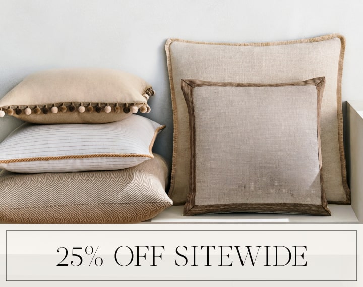 25% Off Sitewide in black text over an image of Square Pillows in neutral fabrics with trim.