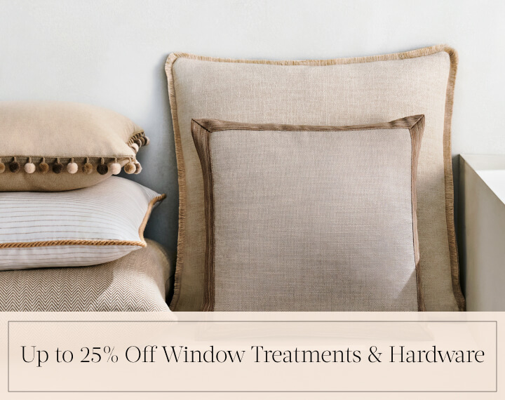 Up to 25% Off Window Treatments & Hardware in black text over an image of Square Pillows in neutral fabrics with various trim