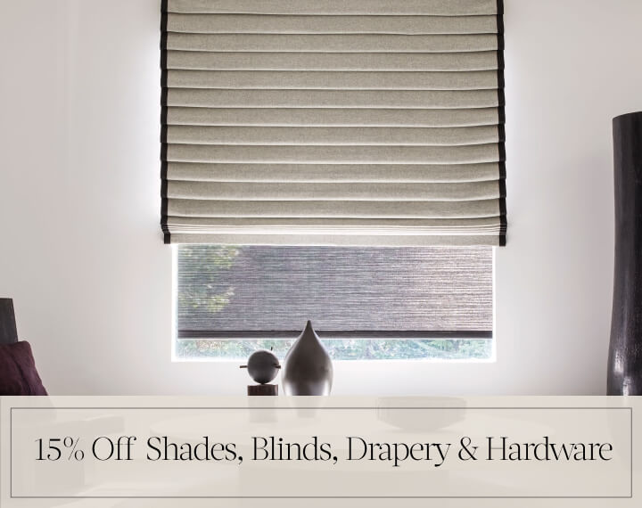 15% Off Shades, Blinds, Drapery & Hardware in black text over an image of layered Shades & Drapery in a room with wood decor