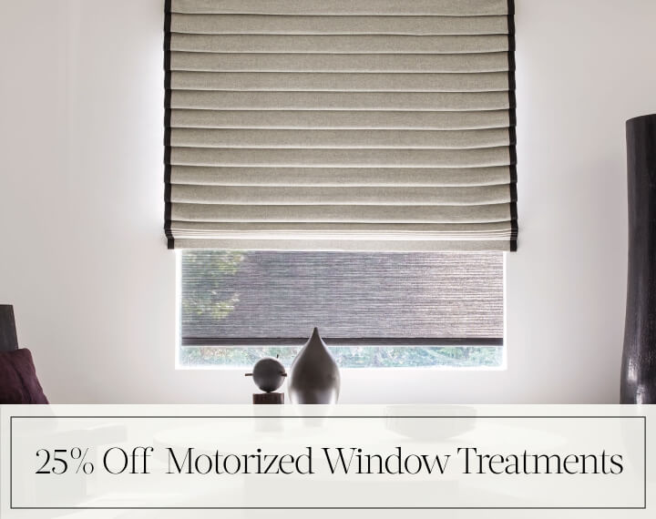 25% Off Motorized Window Treatments in black text over an image of a Pleated Roman Shade in Wool Blend in a room