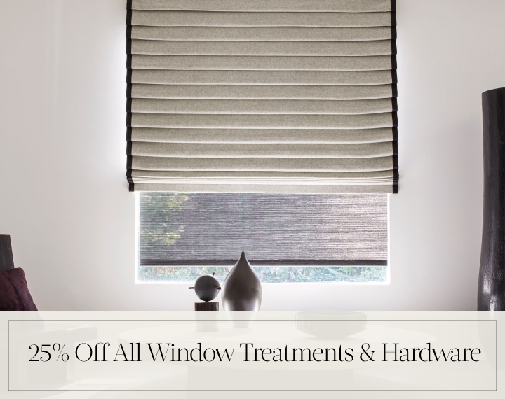 25% Off All Window Treatments & Hardware in black text over an image of a Pleated Roman Shade in Wool Blend in a room