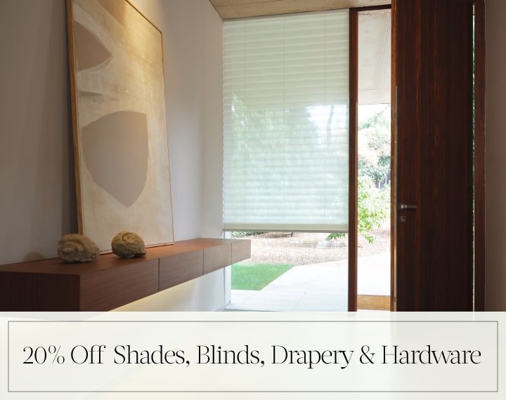 20% Off Shades, Blinds, Drapery & Hardware in black text over an image of a window with a light filtering Pleated Shade.