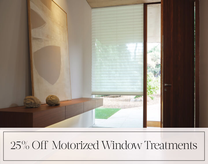 25% Off Motorized Window Treatments in black text over an image of an entry way window with a light filtering Pleated Shade.