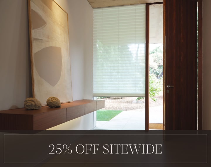 25% Off Sitewide in white text over an image of a window with a light filtering Pleated Shade.
