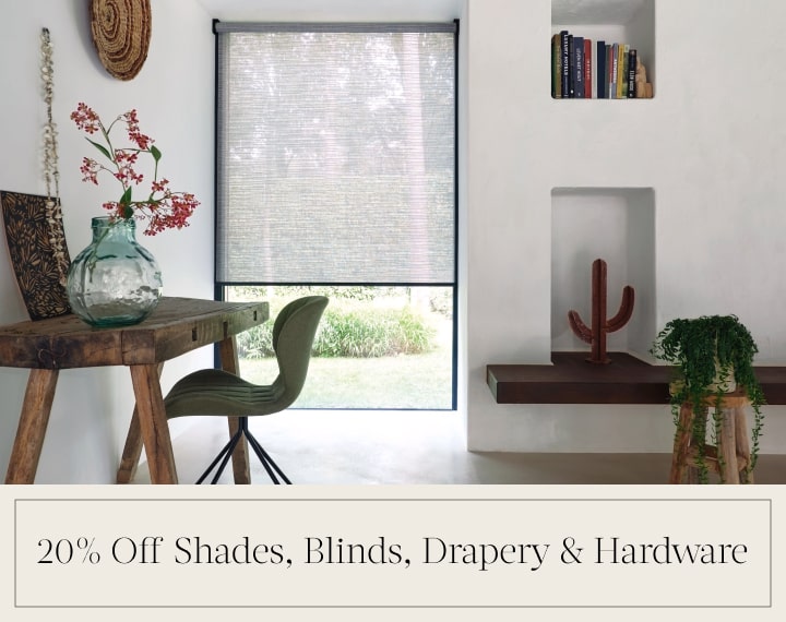 20% Off Shades, Blinds, Drapery & Hardware in black text over an image of an office window with grey roller shades.