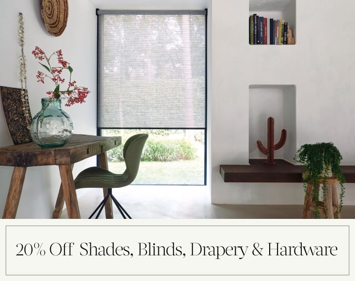 20% Off Shades, Blinds, Drapery & Hardware in black text over an image of an office window with grey roller shades.
