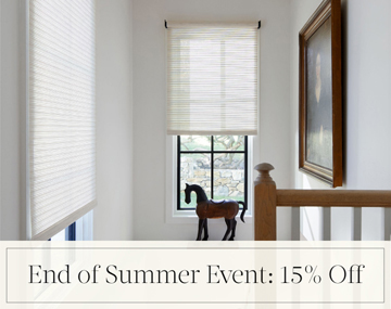 End of Summer Event: 15% Off written in black text over an image of Roller Shades on windows in a stairwell