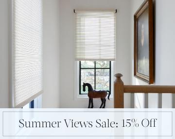 Roller Shades made of Mesa Verde cover stairwell windows with overlaid sales messaging for Summer Views Sale: 15% Off