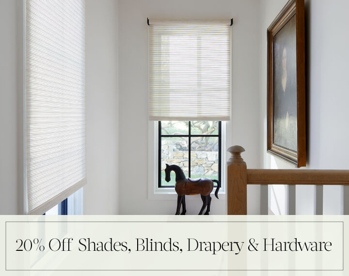 20% Off Shades, Blinds, Drapery & Hardware in black text over an image of Roller Shades on windows in a stairwell