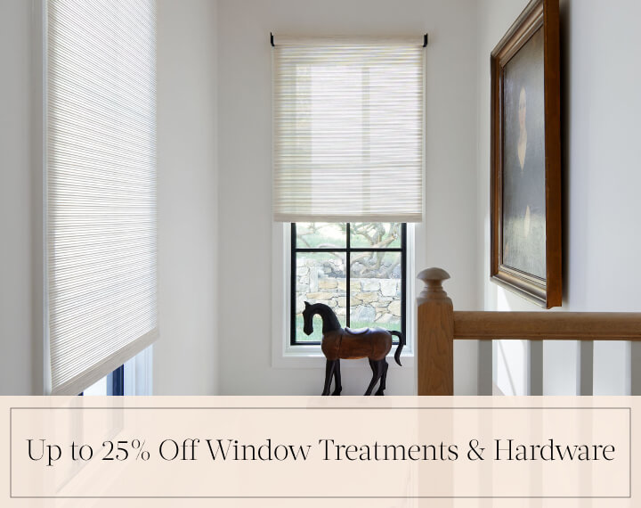 Up to 25% Off Window Treatments & Hardware in black text over an image of Roller Shades on windows in a stairwell