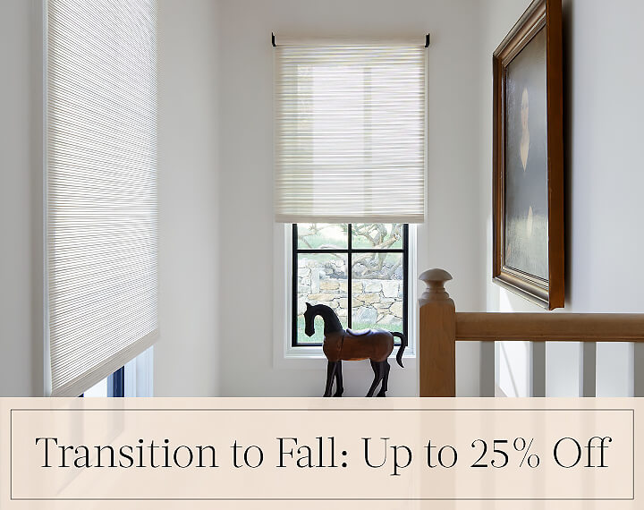 Transition to Fall: Up to 25% Off written in black text over an image of Roller Shades on windows in a stairwell