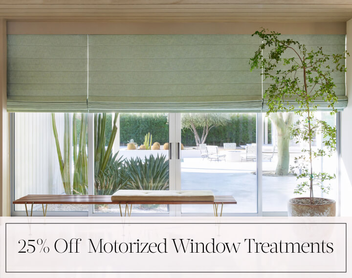 25% Off Motorized Window Treatments in black text over an image of living room windows with sage green Roman Shades.