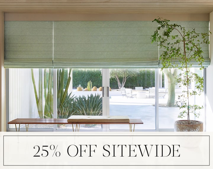 25% Off Sitewide in black text over an image of living room windows with sage green Roman Shades.