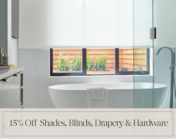 15% Off Shades, Blinds, Drapery & Hardware in black text over an image of Blackout Drapery & Roller Shades in a bedroom