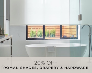 Light Filtering Solar Shades cover a window in a white bathroom with a freestanding tub with overlaid sales messaging