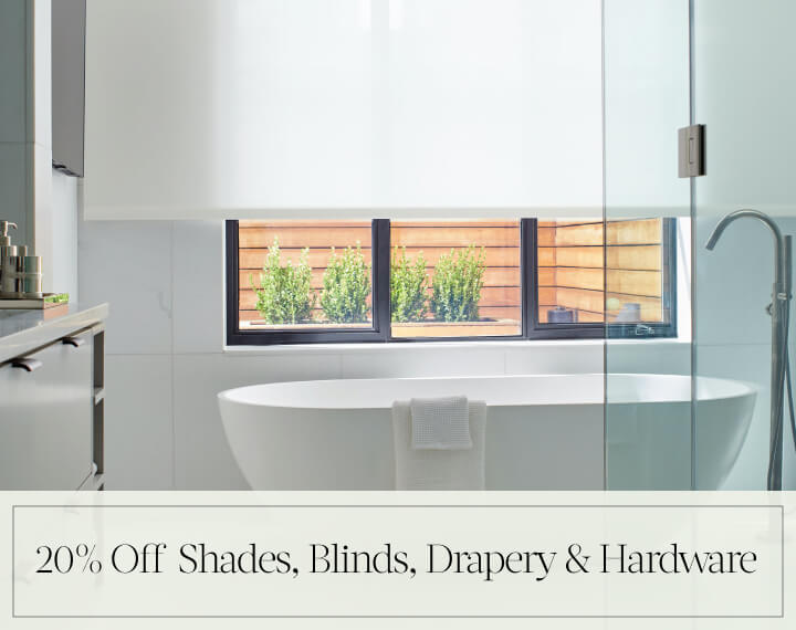 20% Off Shades, Blinds, Drapery & Hardware in black text over an image of Solar Shades in a white bathroom with a tub