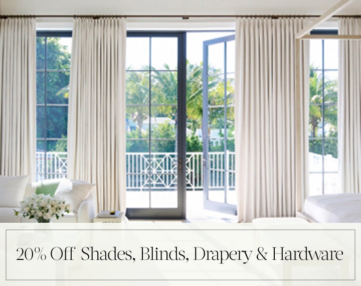 20% Off Shades, Blinds, Drapery & Hardware in black text over an image of Tailored Pleat Drapery on bedroom patio doors.